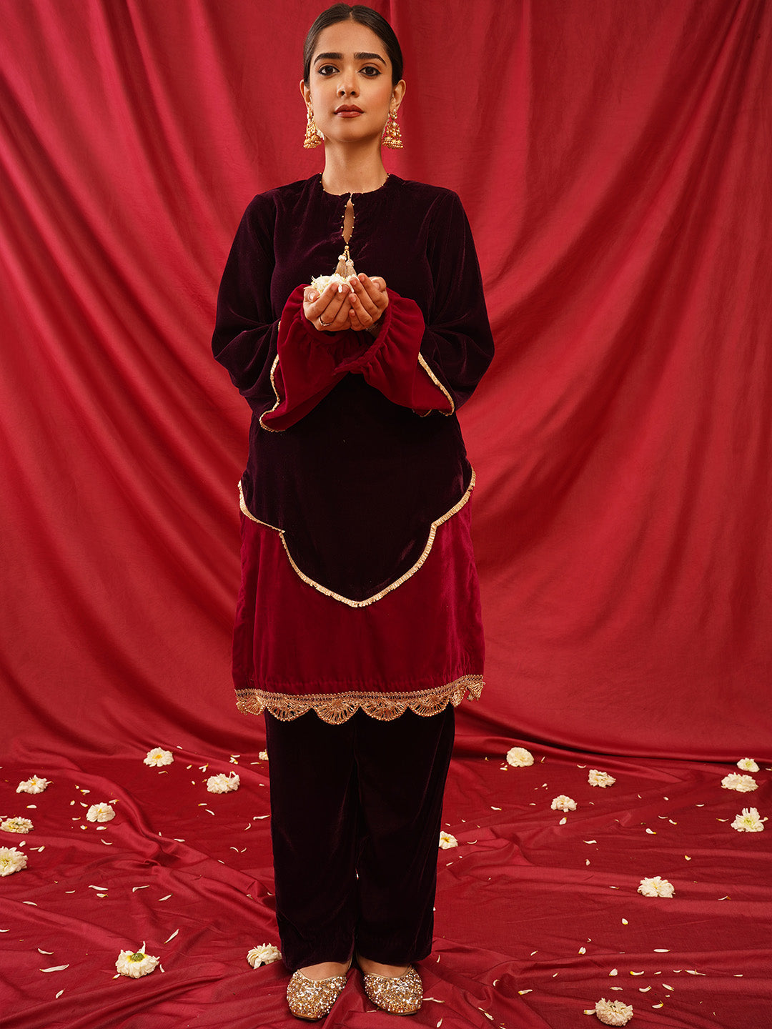 traditional juttis heavily embellished with sequins and a large floral motif at the toe
Golden