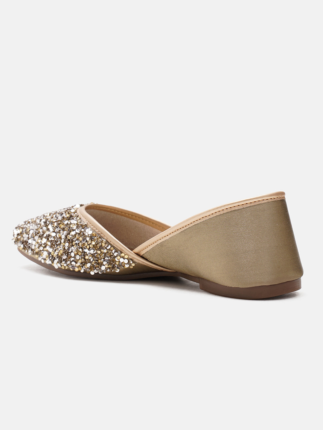 traditional juttis heavily embellished with sequins and a large floral motif at the toe
Green