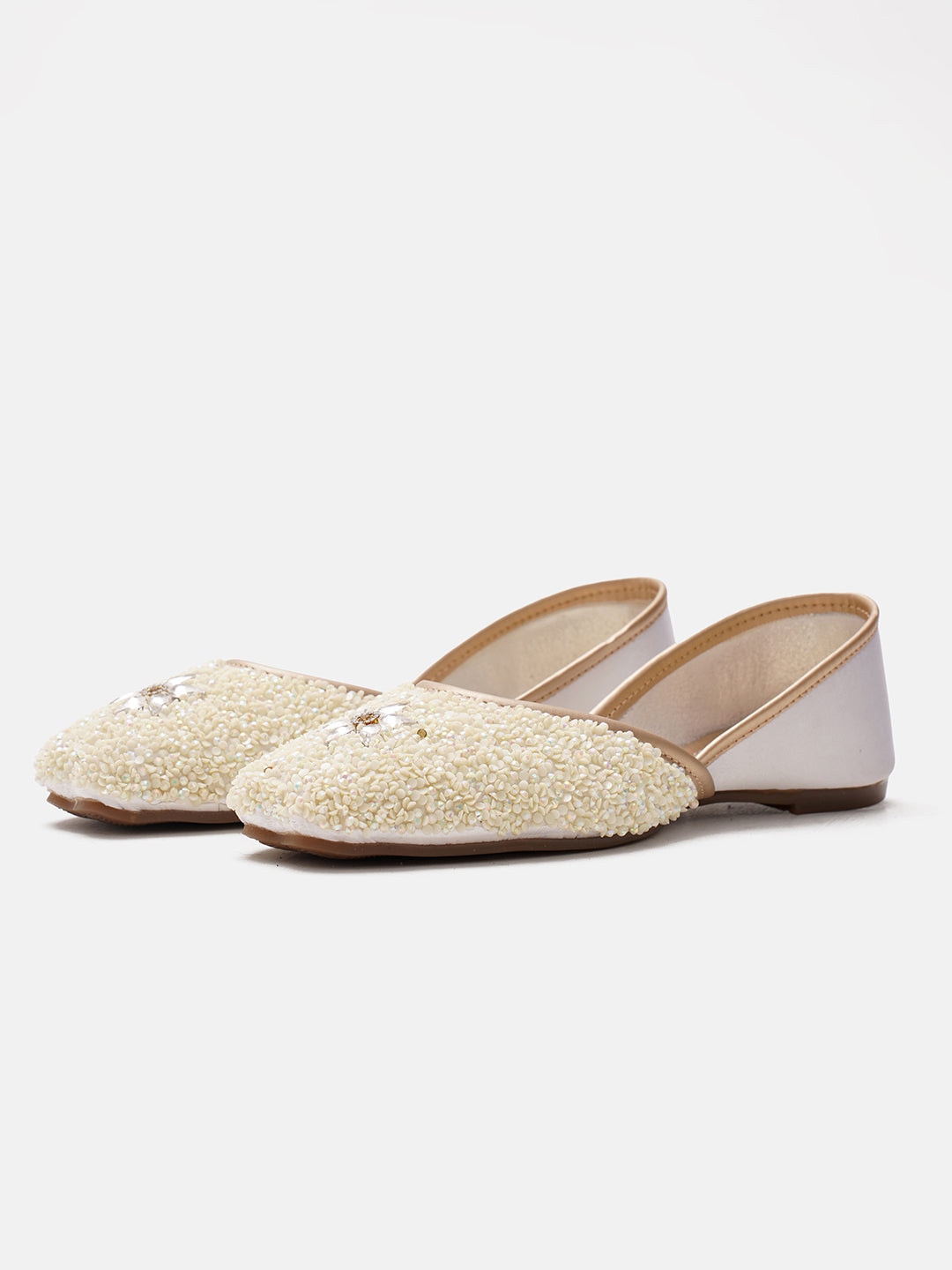traditional juttis heavily embellished with sequins and a large floral motif at the toe
White