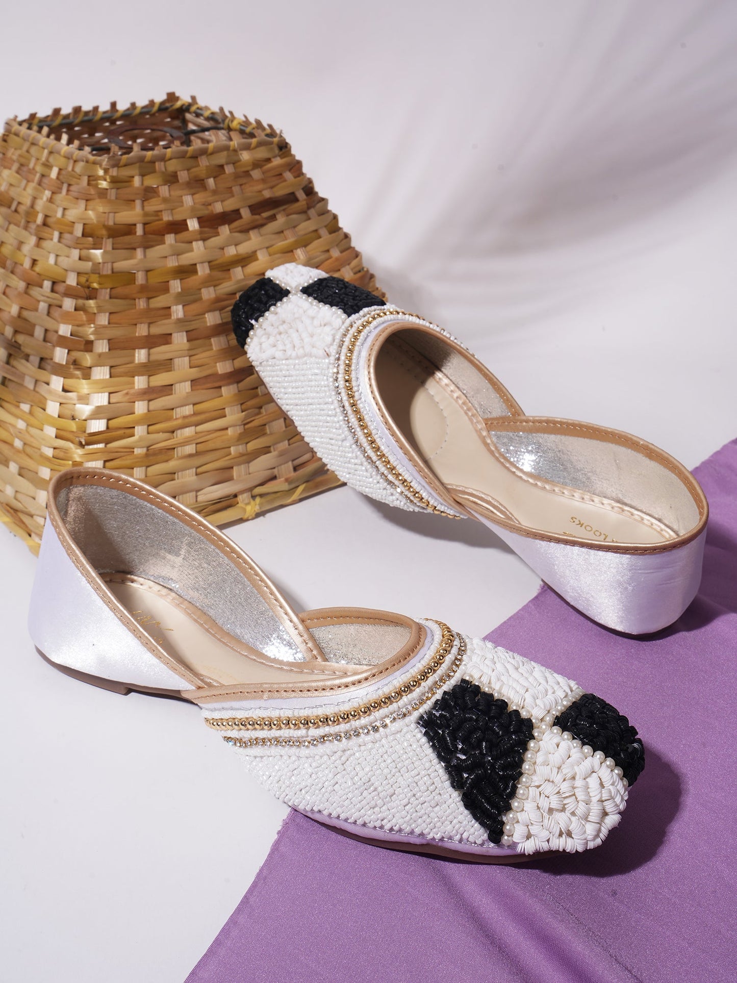 juttis featuring a checkered pattern made from beads
White