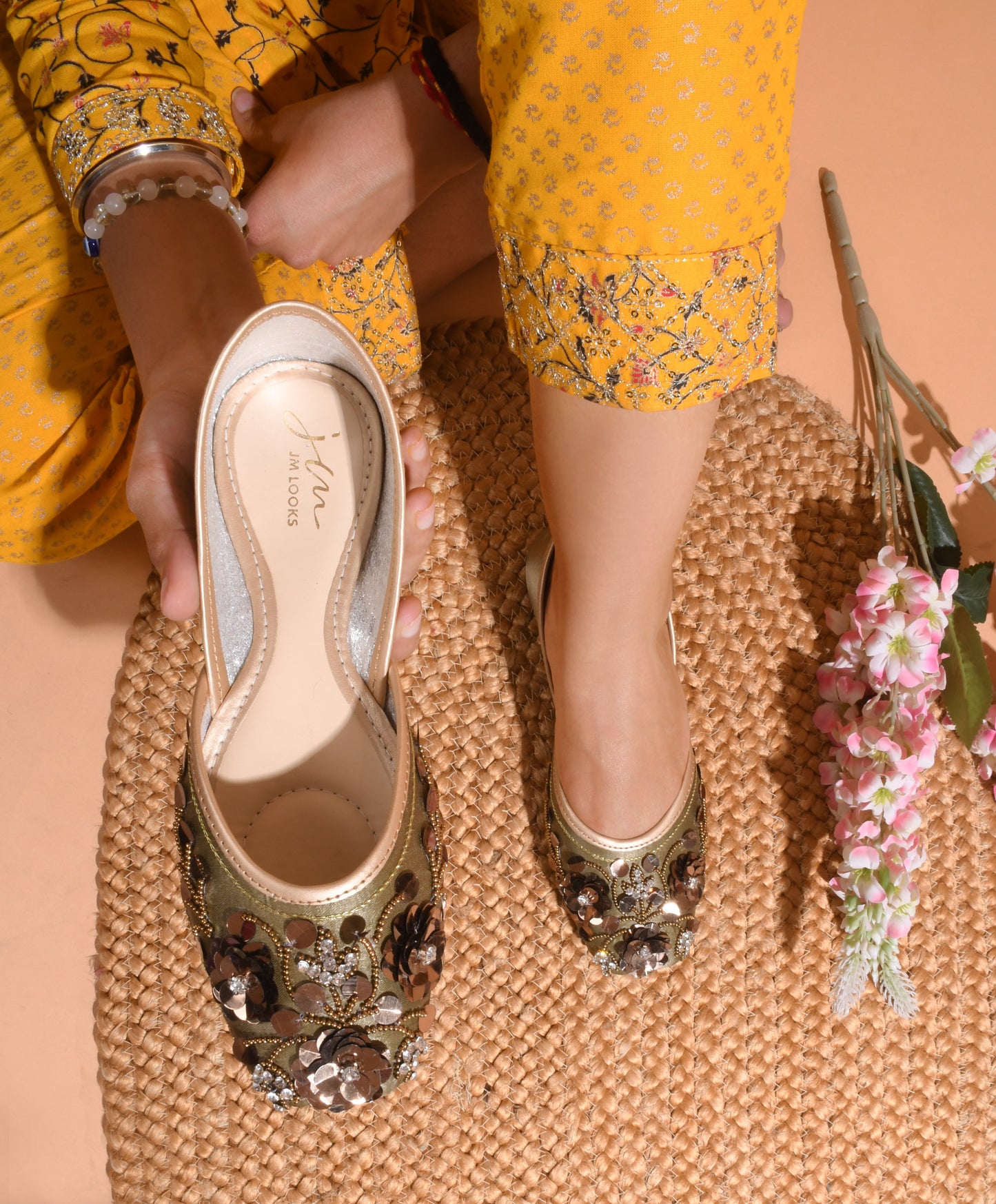exquisitely embellished juttis with floral and beadwork detailing
Copper