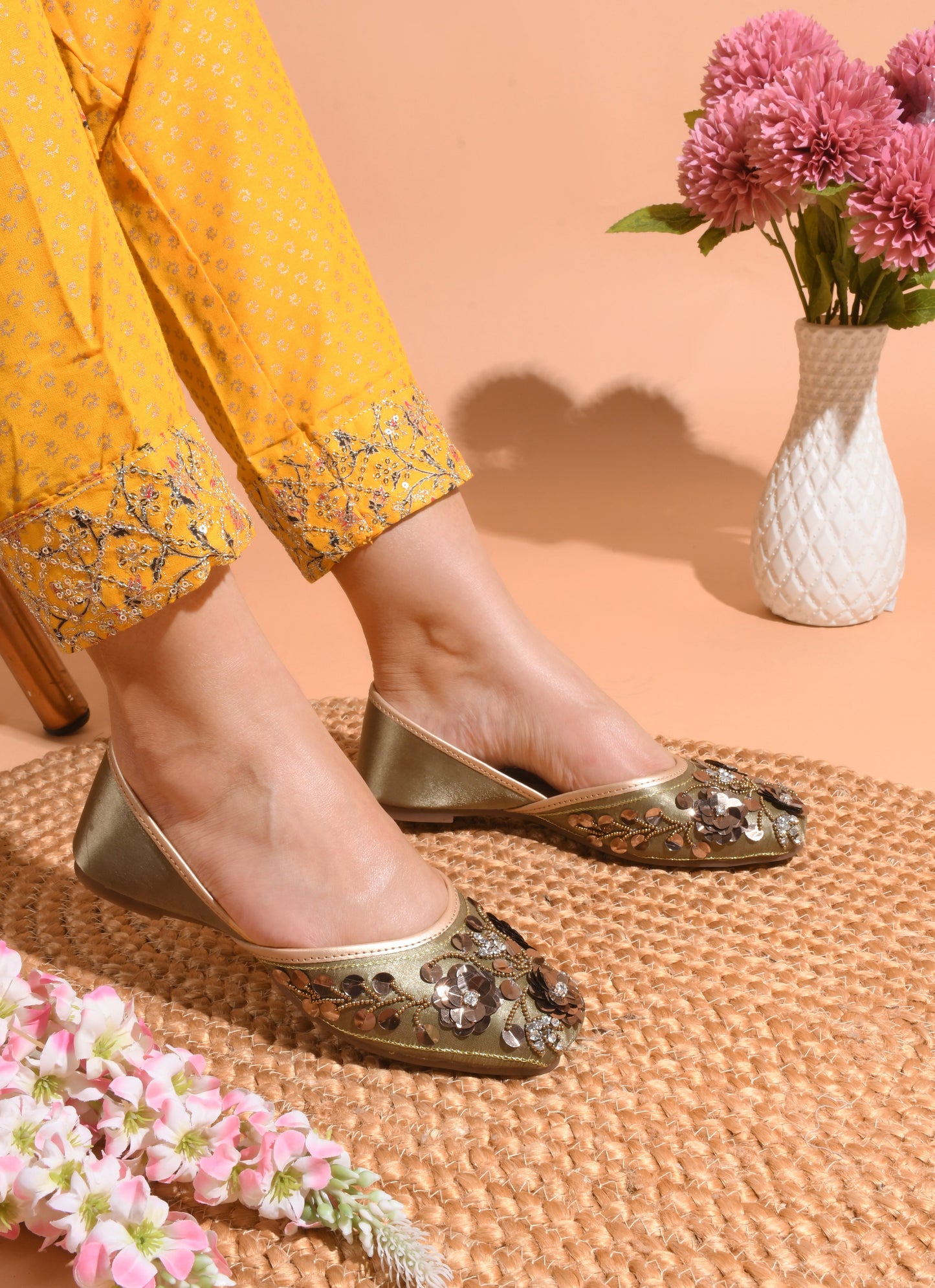exquisitely embellished juttis with floral and beadwork detailing
Copper