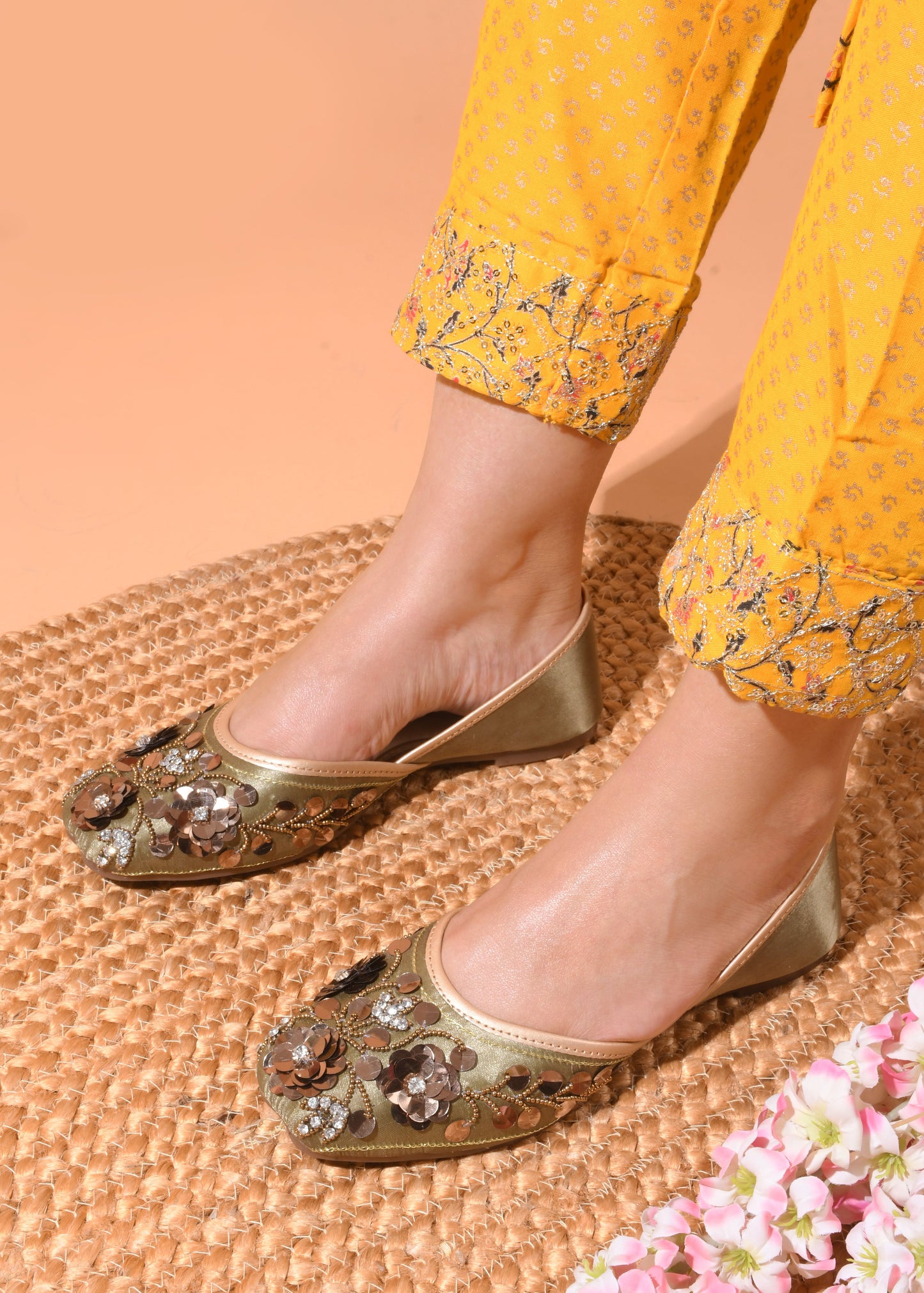 exquisitely embellished juttis with floral and beadwork detailing
Copper