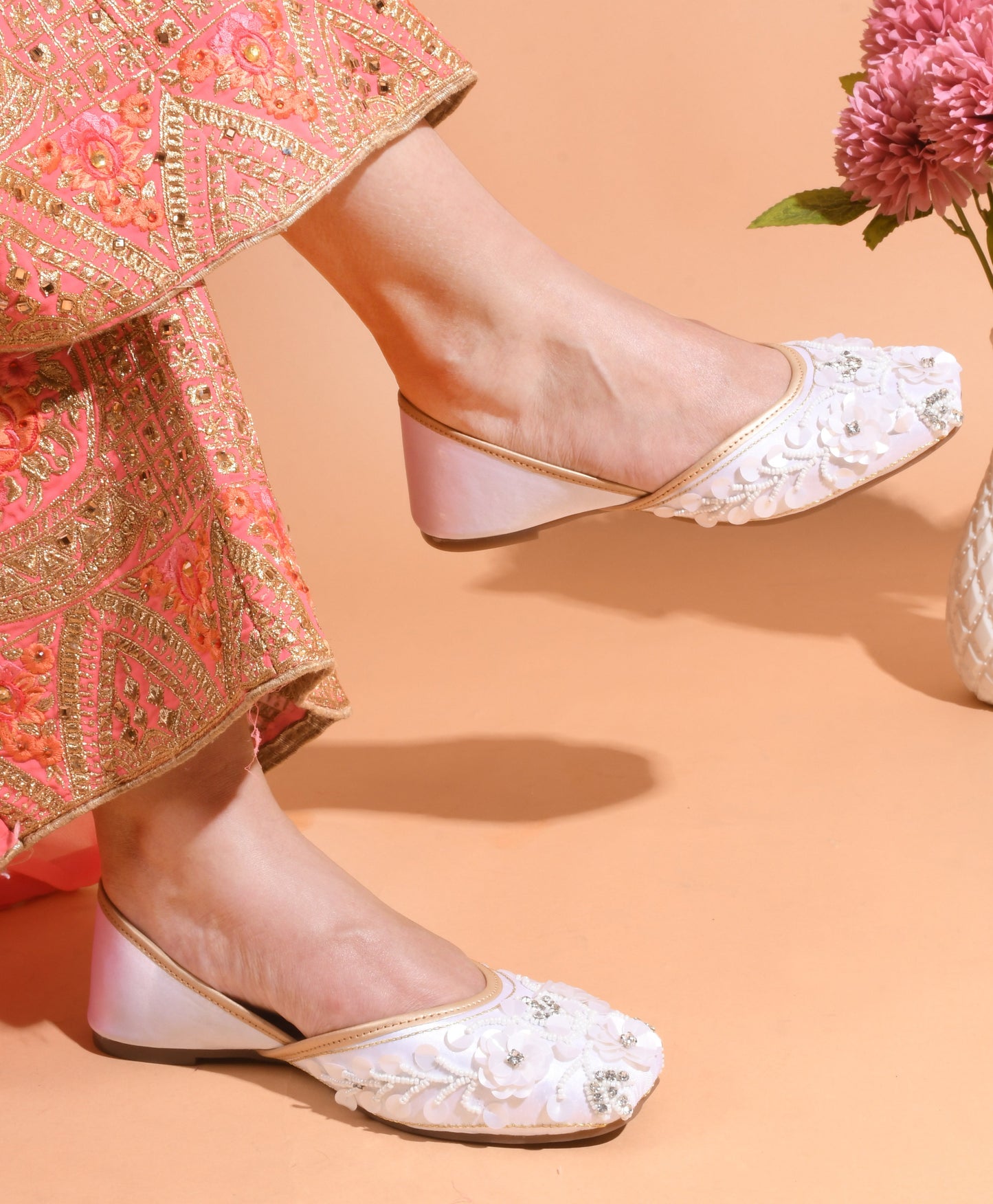 exquisitely embellished juttis with floral and beadwork detailing
White