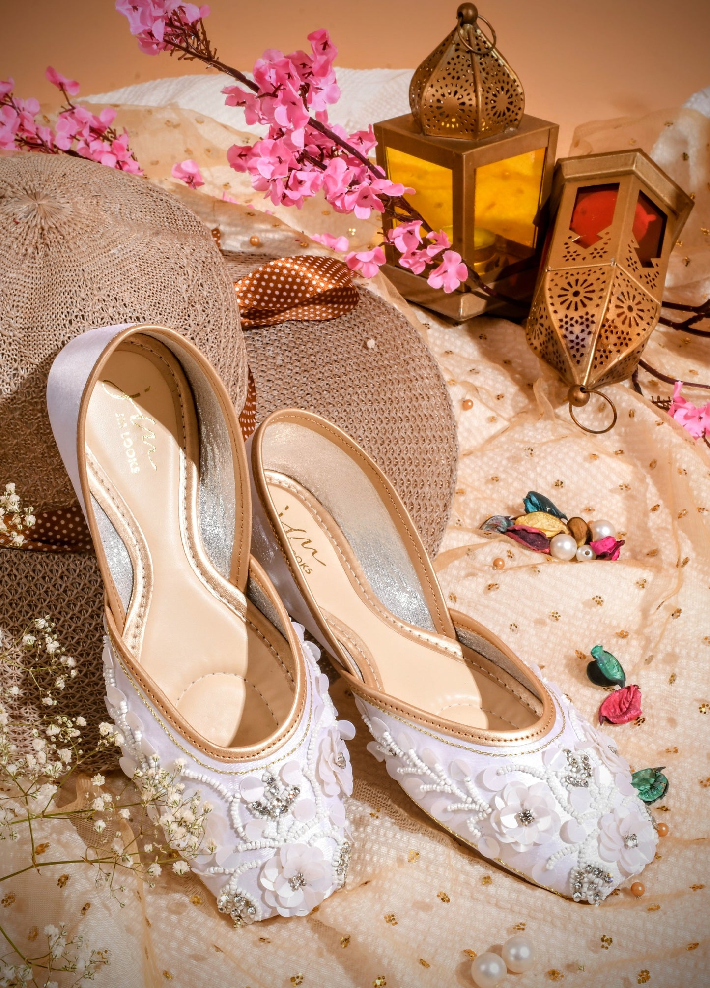exquisitely embellished juttis with floral and beadwork detailing
White