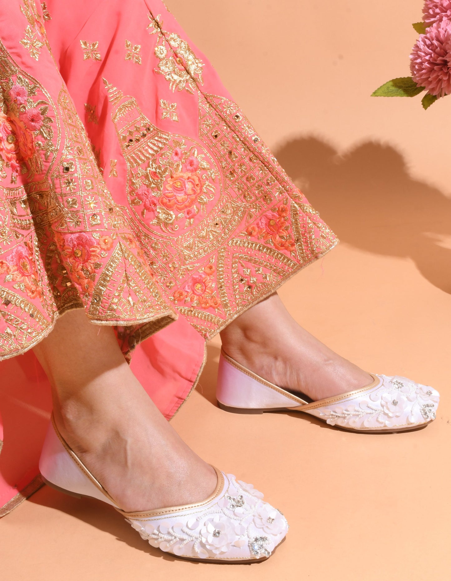 exquisitely embellished juttis with floral and beadwork detailing
White