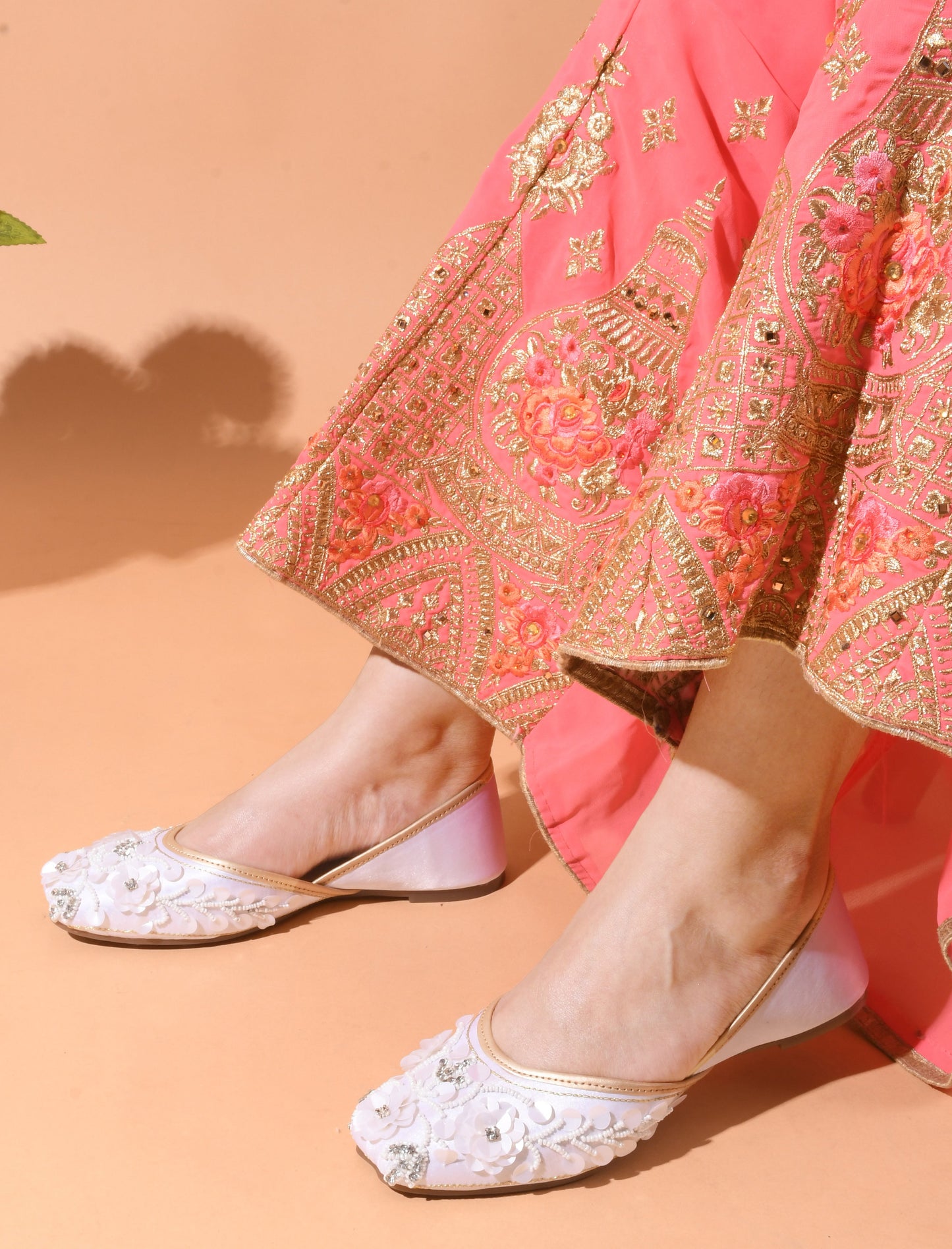 exquisitely embellished juttis with floral and beadwork detailing
White