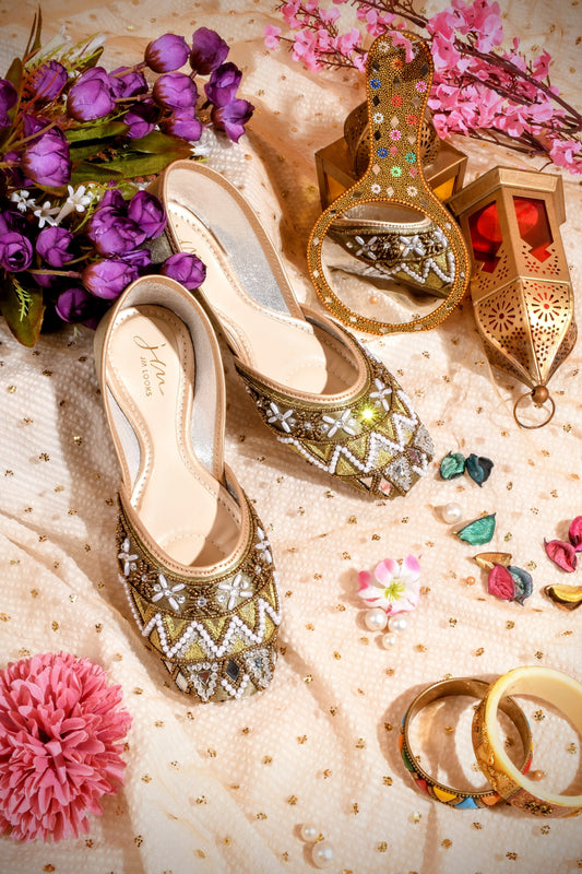 intricately embellished traditional juttis with geometric patterns and beadwork
 Green