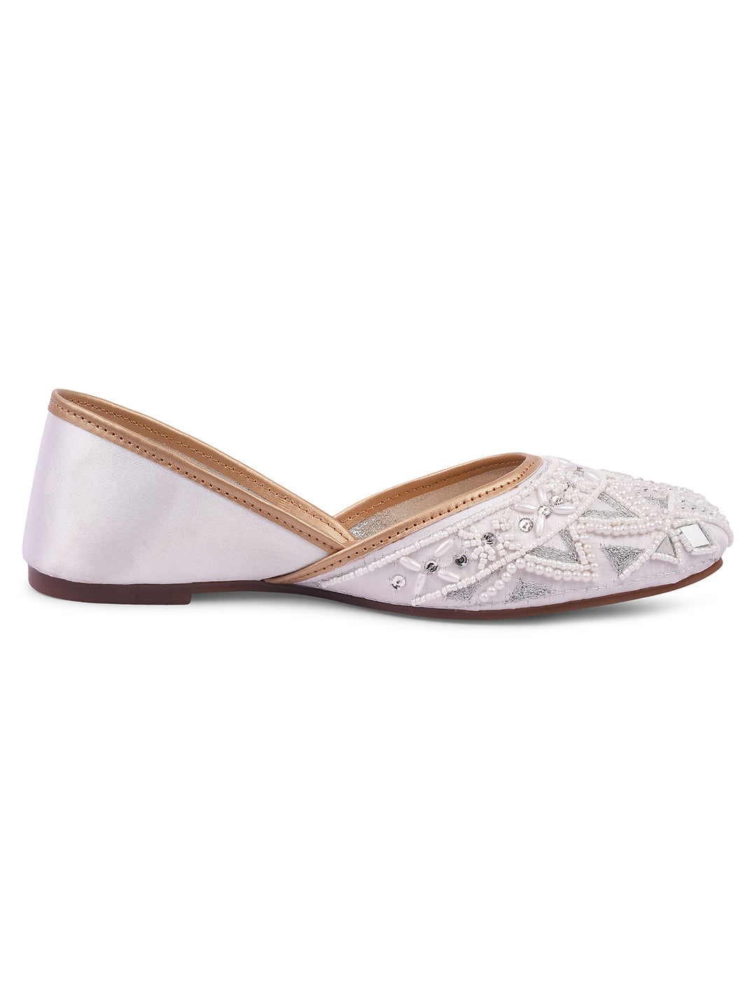 intricately embellished traditional juttis with geometric patterns and beadwork
White