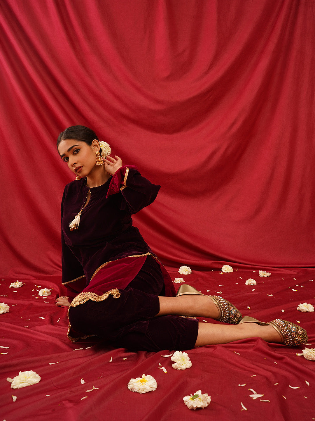 traditional juttis with intricate floral embroidery and detailed beadwork on the upper
Green