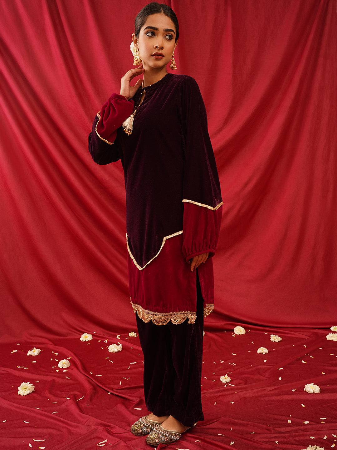 traditional juttis with intricate floral embroidery and detailed beadwork on the upper
Green