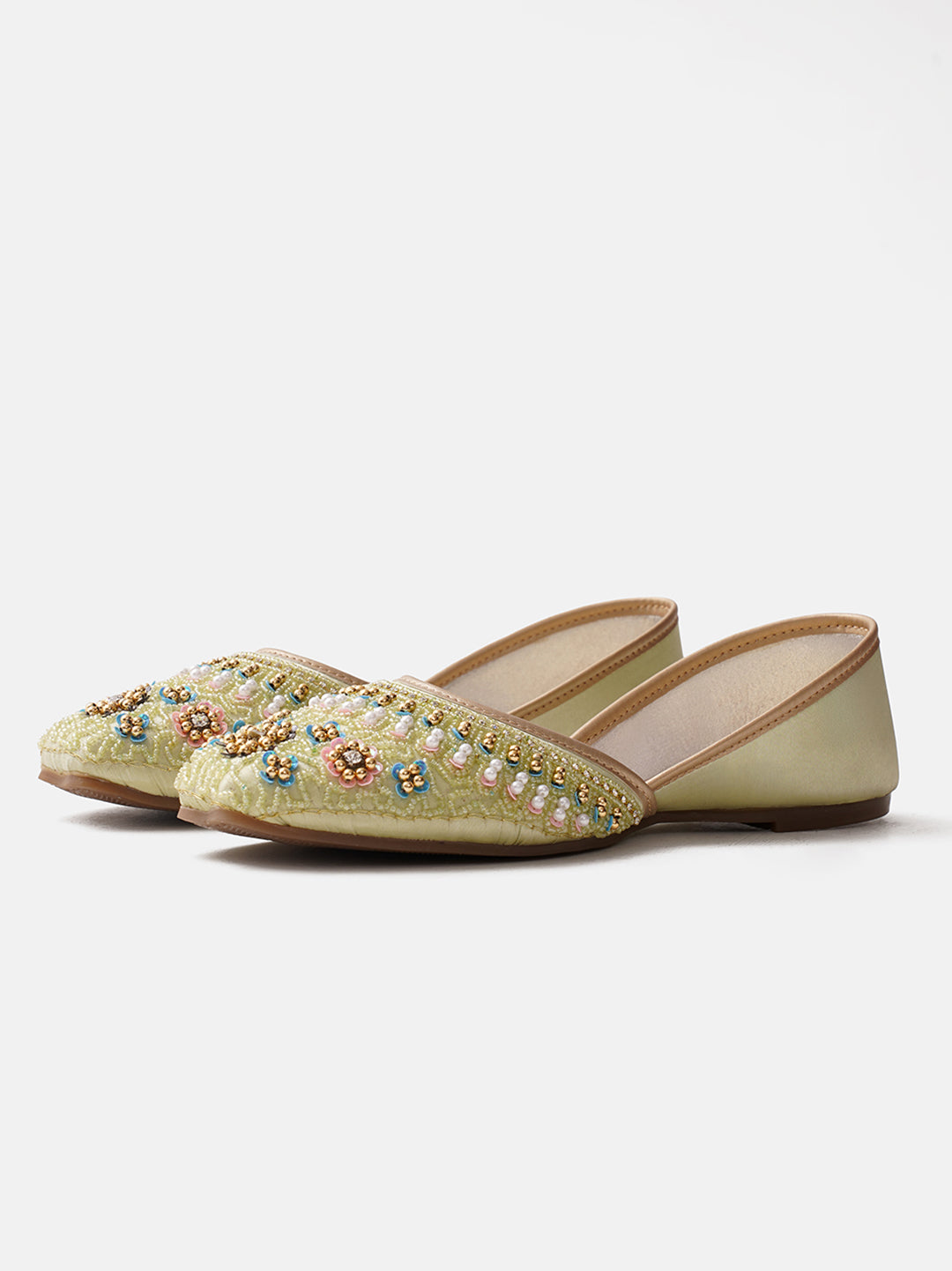 traditional juttis with intricate floral embroidery and detailed beadwork on the upper
Pista