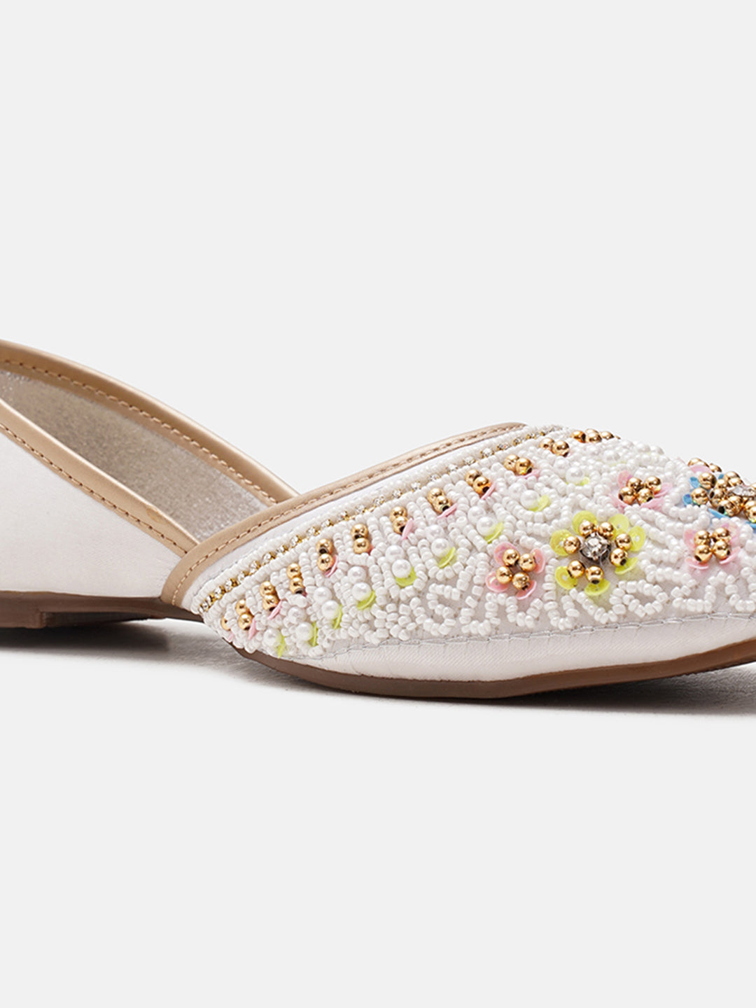 traditional juttis with intricate floral embroidery and detailed beadwork on the upper
White