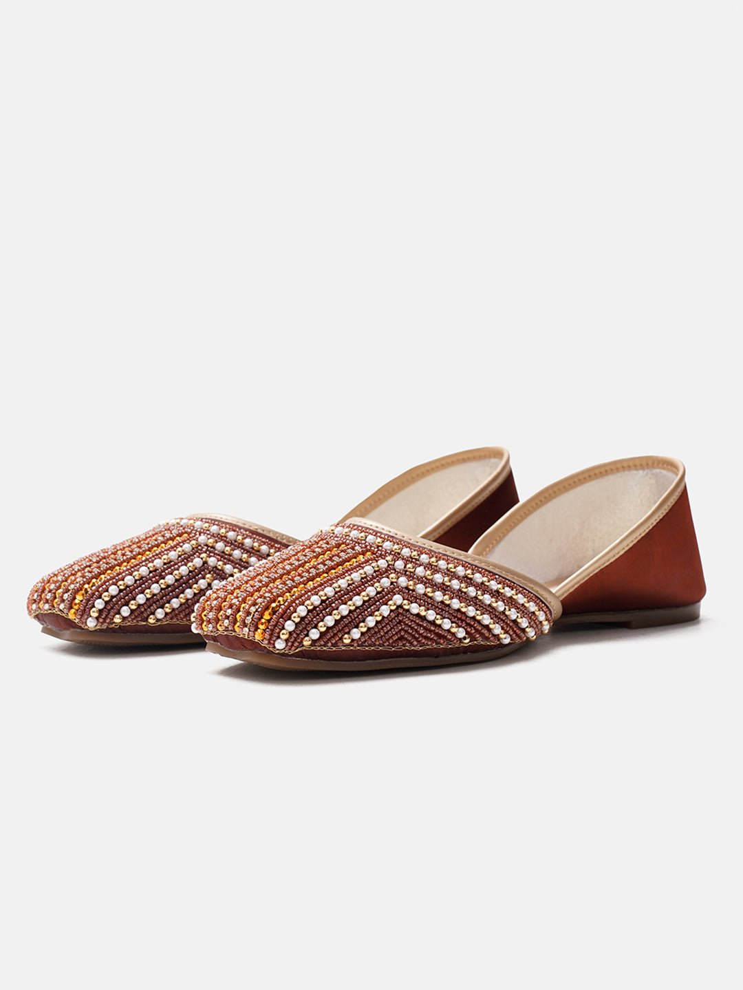 traditional juttis with intricate striped beadwork covering the entire upper
Copper