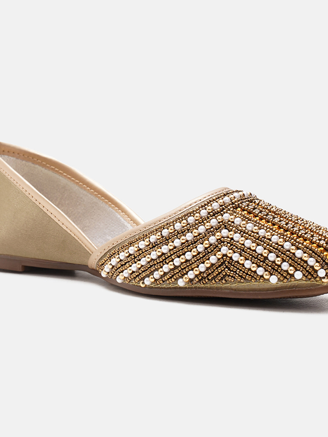 traditional juttis with intricate striped beadwork covering the entire upper
White
