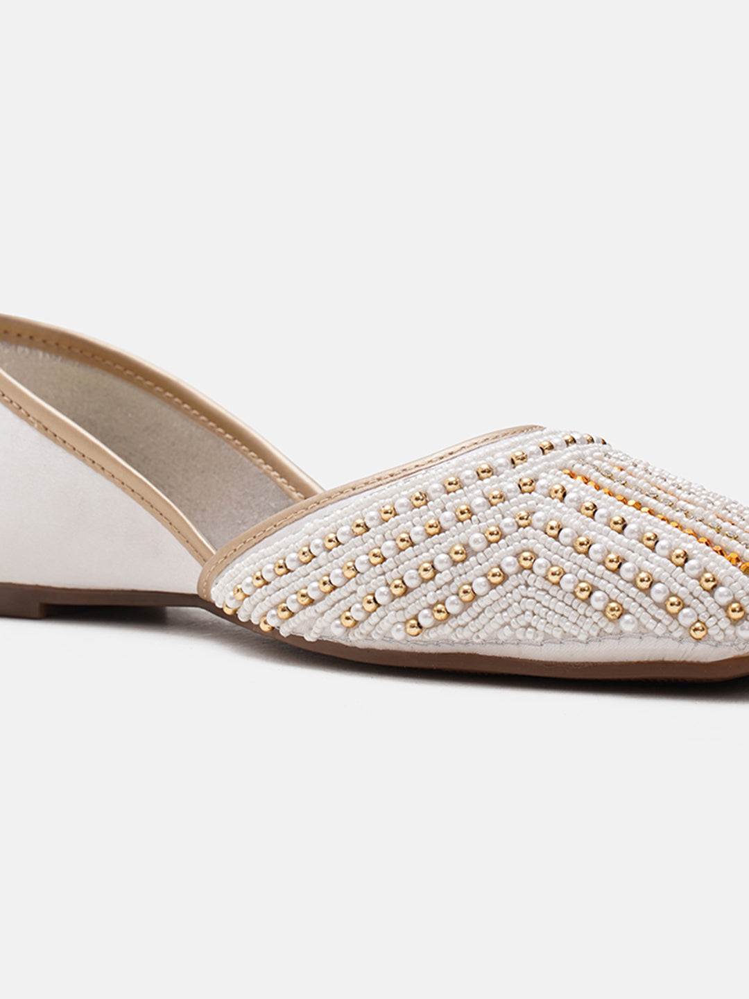 traditional juttis with intricate striped beadwork covering the entire upper
Green