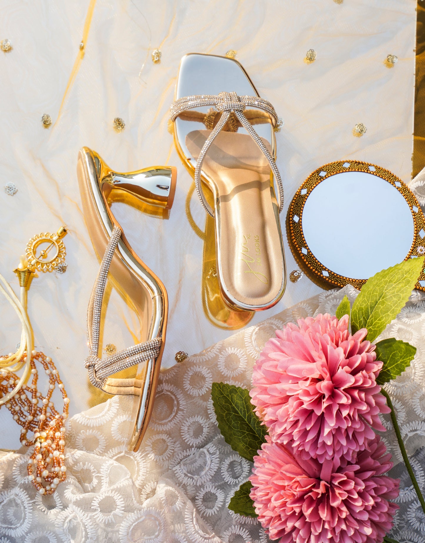 embellished strappy heeled sandals with a unique sculpted heel
Golden
