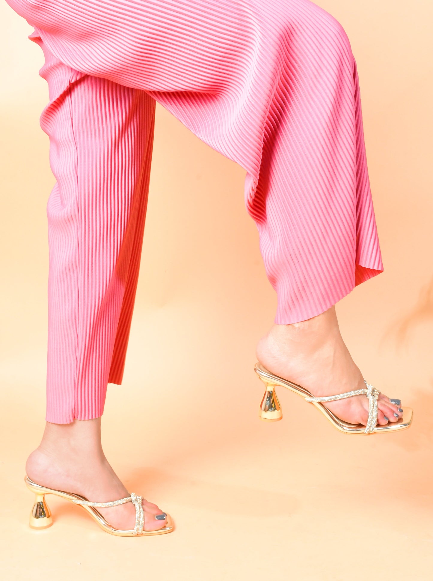 embellished strappy heeled sandals with a unique sculpted heel
Golden