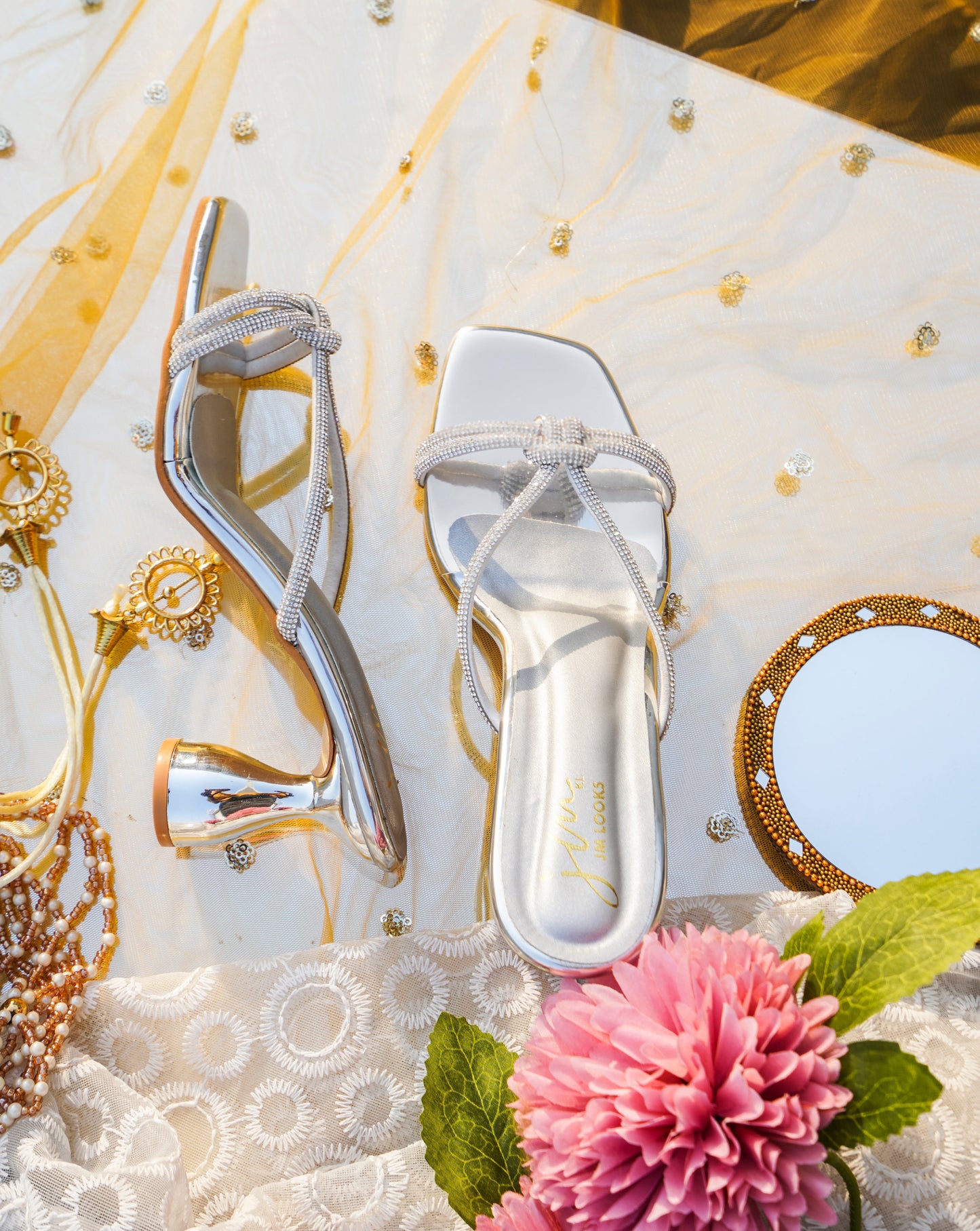 embellished strappy heeled sandals with a unique sculpted heel
Silver