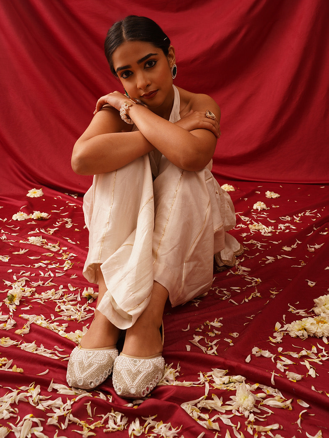 traditional juttis heavily embellished with pearls and beads on the upper
Green