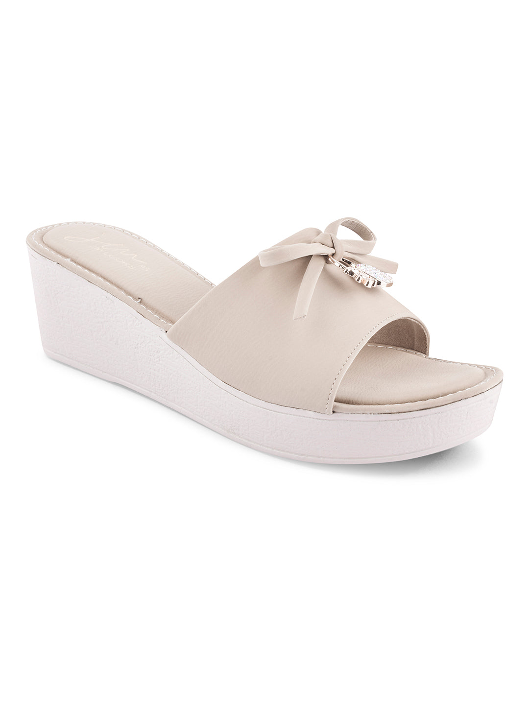 Jm Looks wedge slides with a decorative bow on the strap
Cream