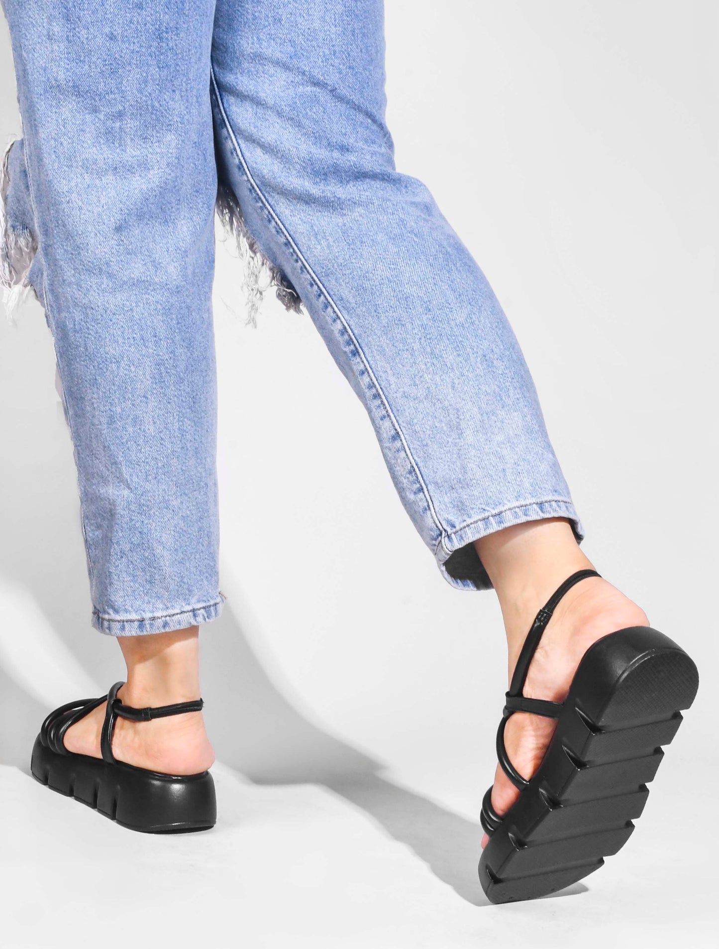 JM Looks strappy platform sandals with a lug sole and an ankle strap
Black