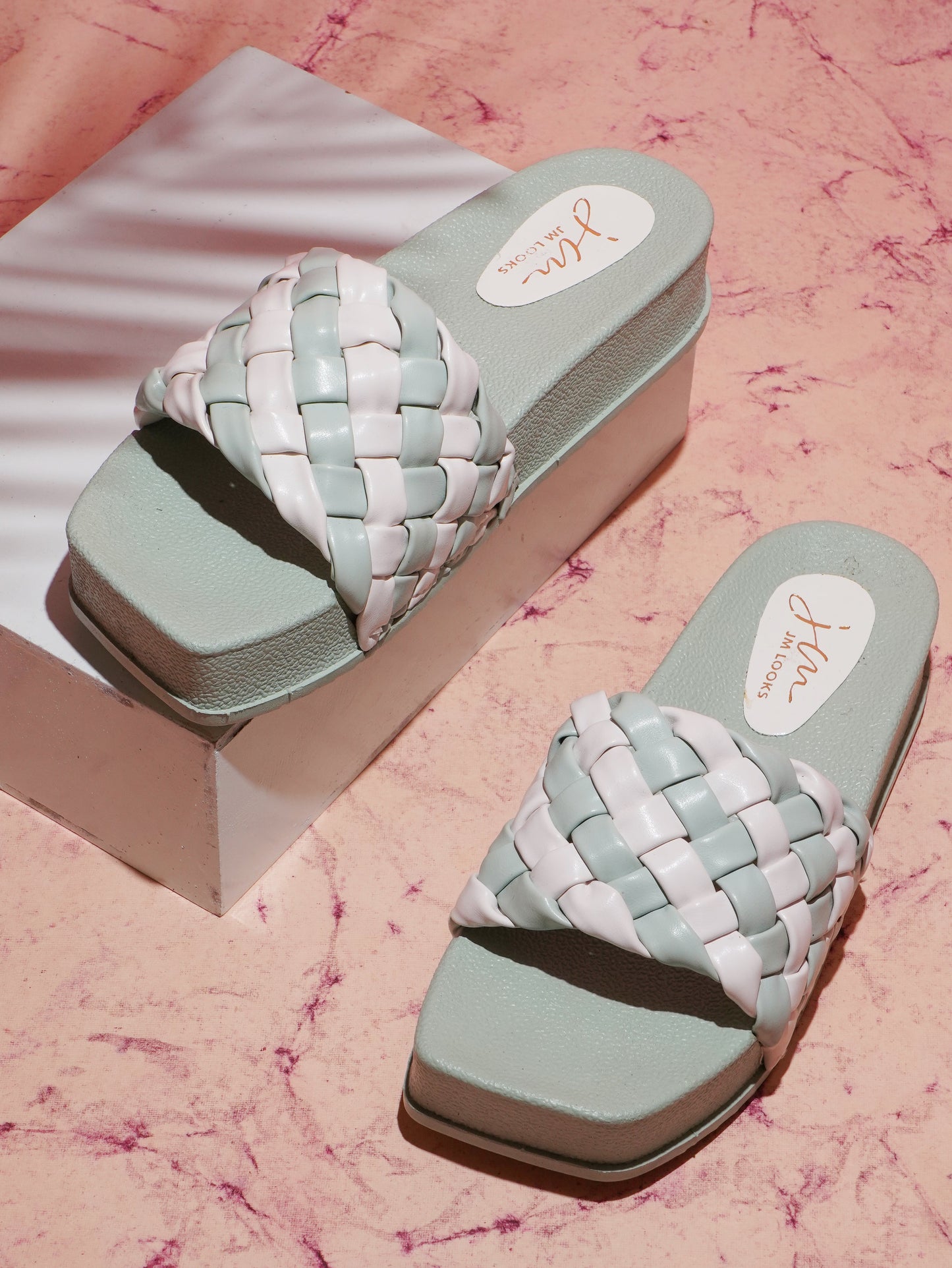 Jm Looks platform slides with a distinctive braided strap
See Green
