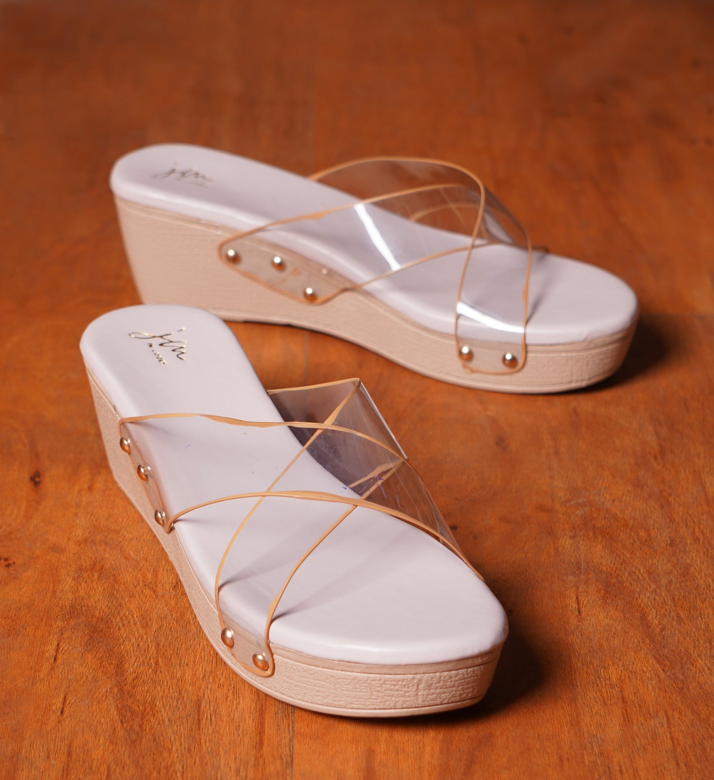 wedge heel slides featuring clear cross straps and a comfortable sole
Lavender
