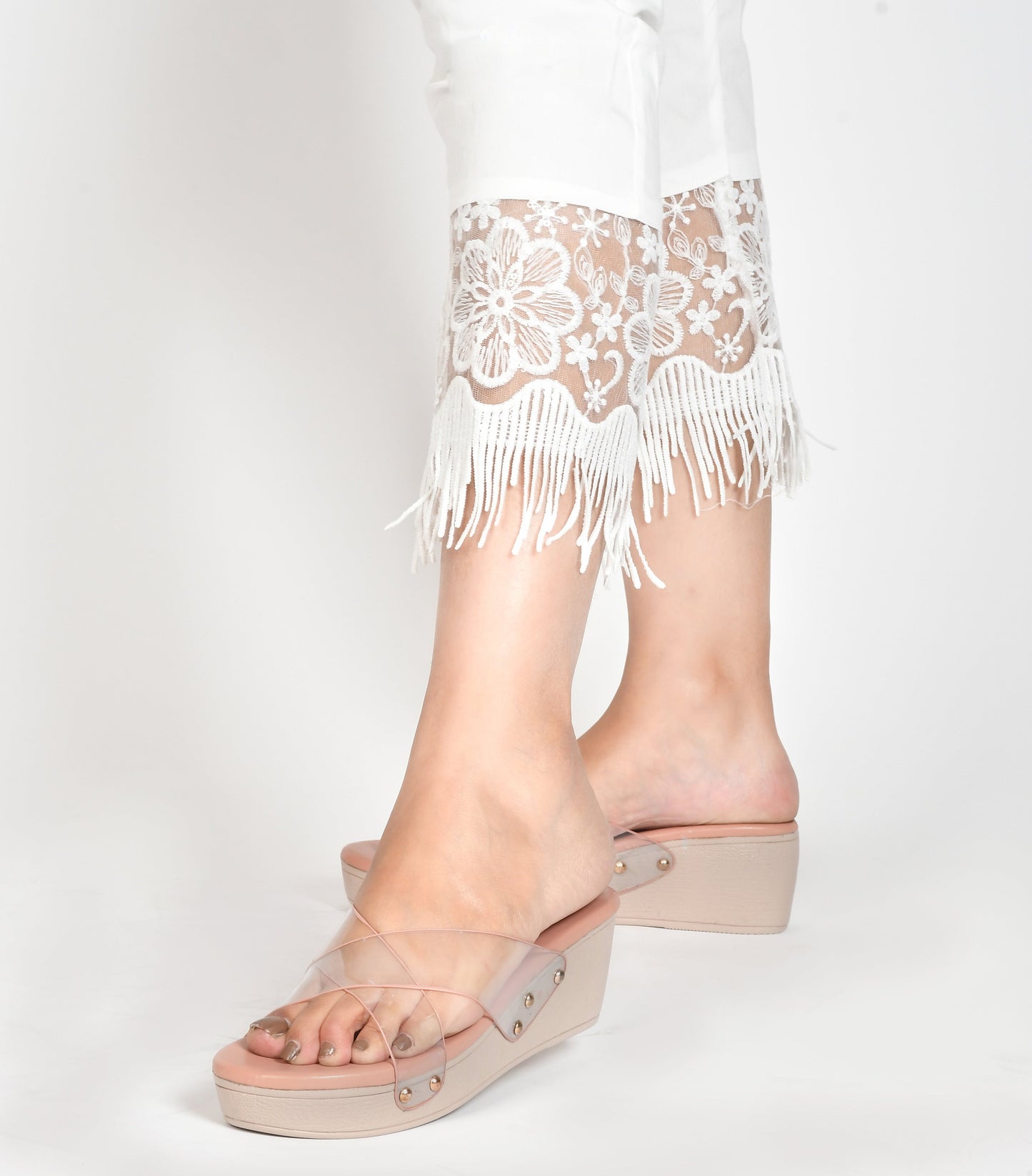 wedge heel slides featuring clear cross straps and a comfortable sole
Peach