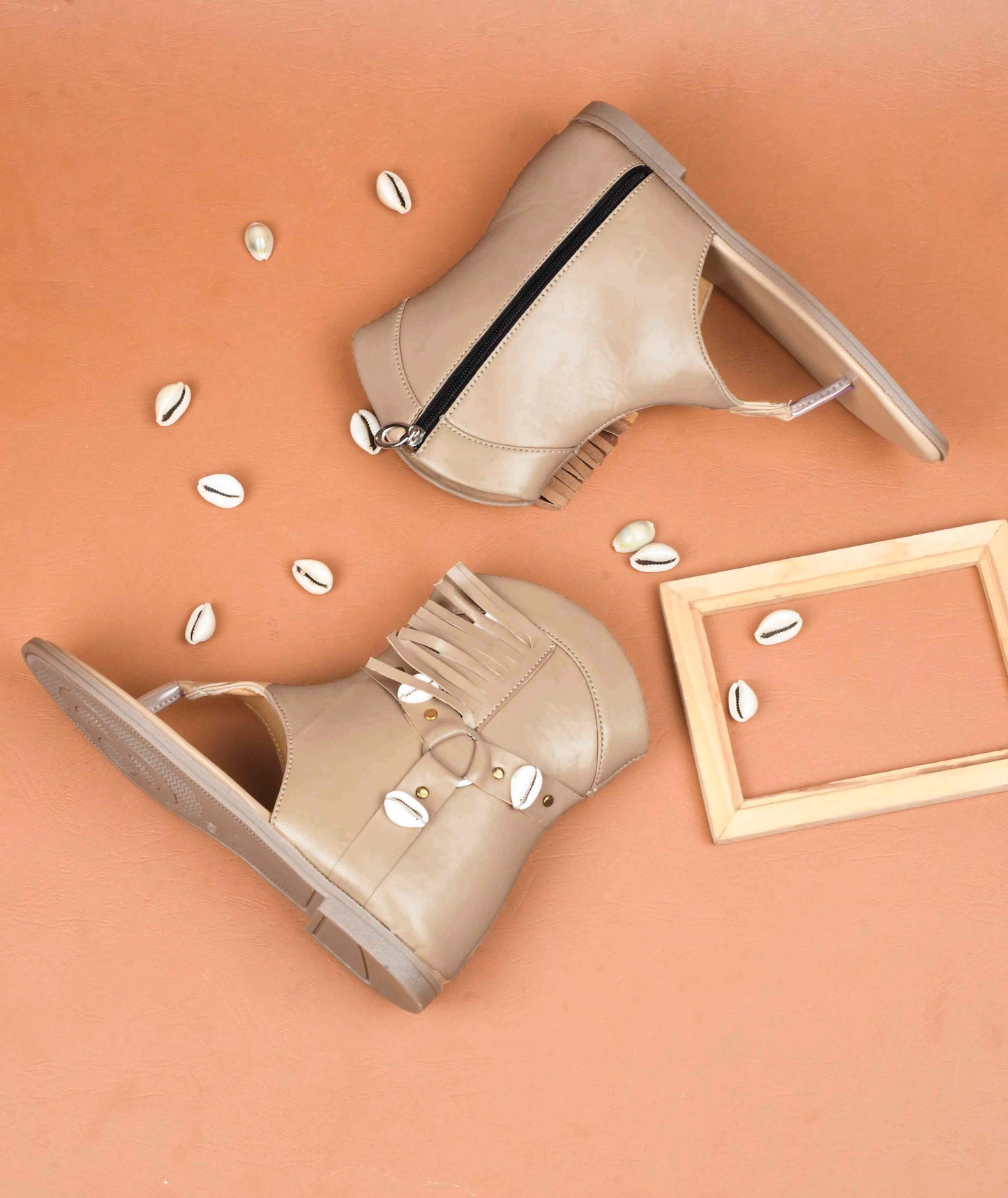 women's high-ankle gladiator sandals featuring shell and fringe embellishments
Beige