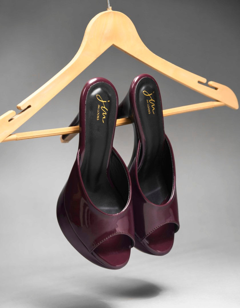 open-toe platform mules with a glossy patent finish and a high heel
Cherry