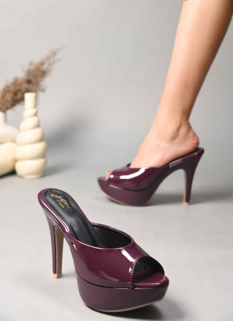 open-toe platform mules with a glossy patent finish and a high heel
Cherry
