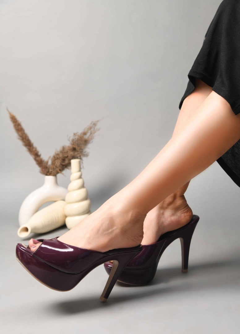 open-toe platform mules with a glossy patent finish and a high heel
Cherry