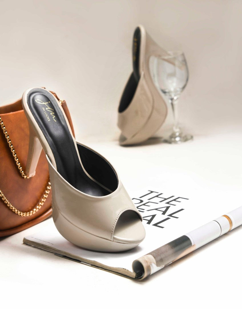 open-toe platform mules with a glossy patent finish and a high heel
Beige