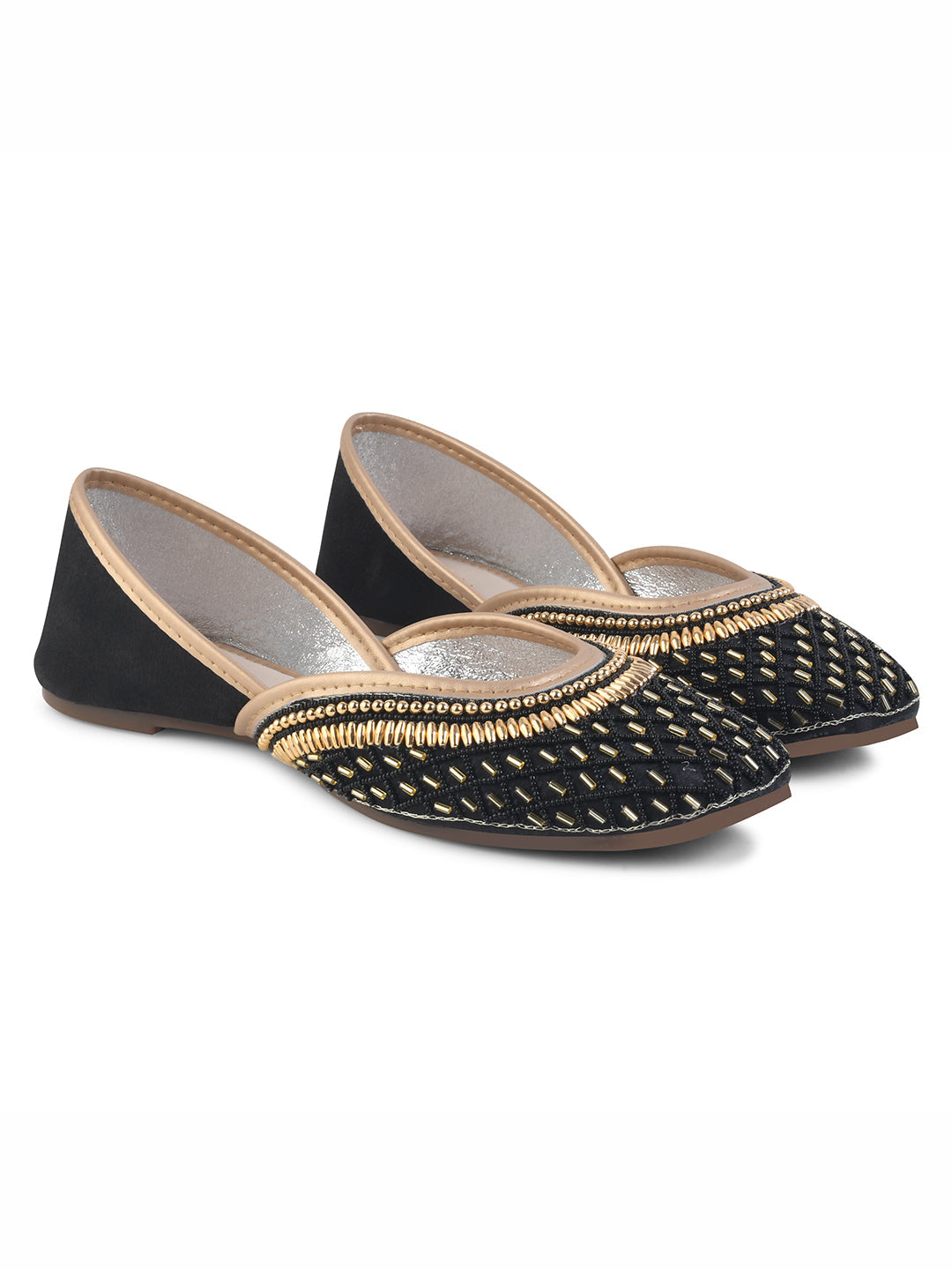 traditional juttis with intricate beaded work in a geometric pattern on the upper
Black