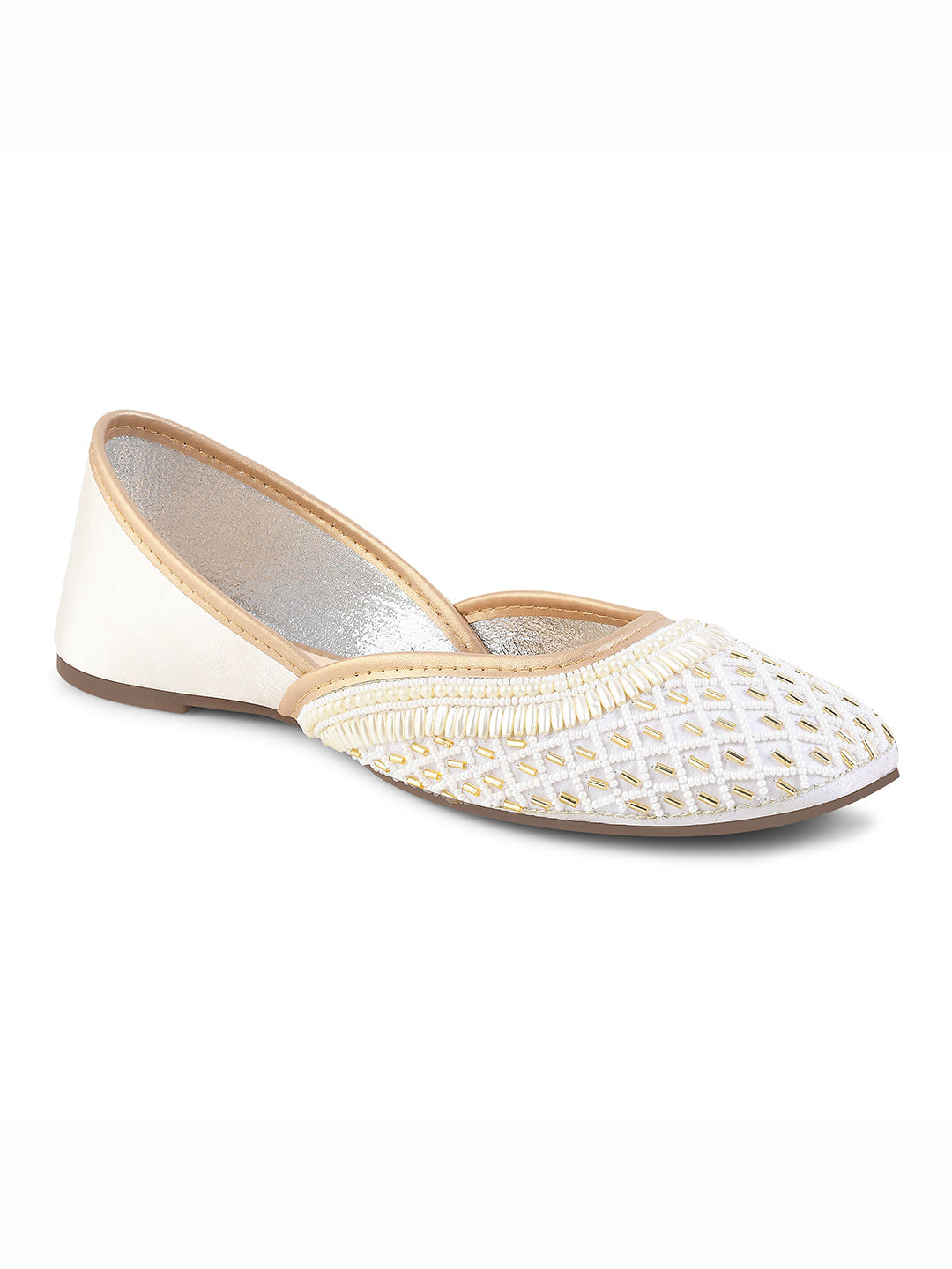 traditional juttis with intricate beaded work in a geometric pattern on the upper
White