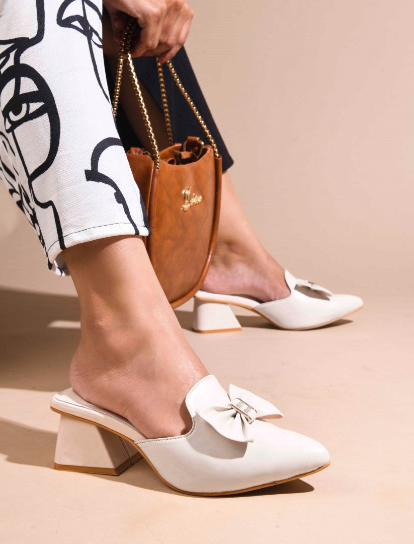 JM Looks women's pointed-toe mules with a decorative bow and a block heel
Cream