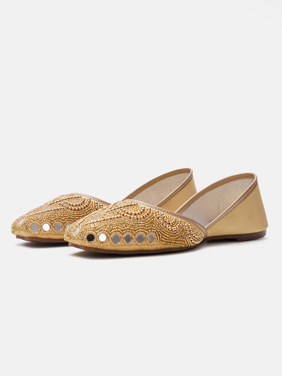 traditional juttis heavily embellished with pearls and beads on the upper
Golden