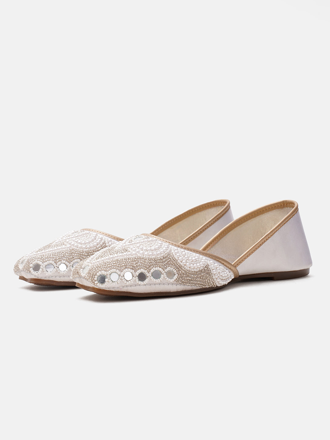 traditional juttis heavily embellished with pearls and beads on the upper
Green