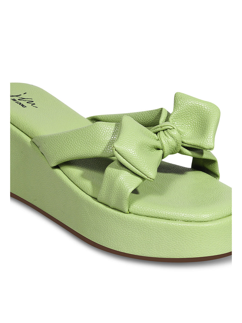 Jm Looks platform slides featuring a large, knotted bow on the strap
 Green