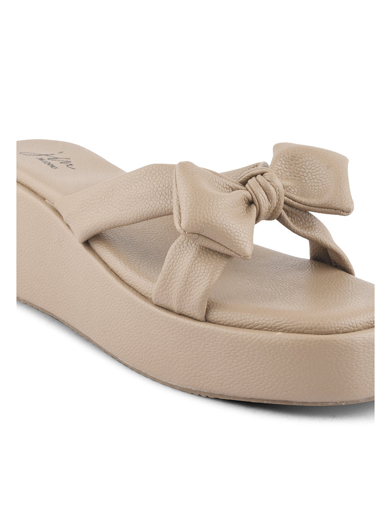 Jm Looks platform slides featuring a large, knotted bow on the strap
 Tan