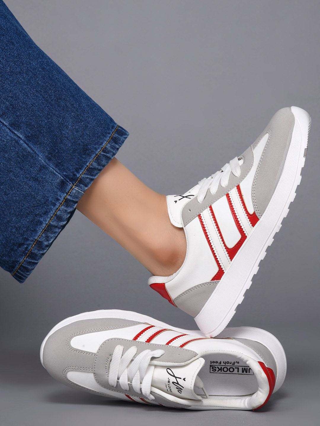 Women's lace-up casual sneakers in grey white with red stripe detailing on cushioned white platform sole