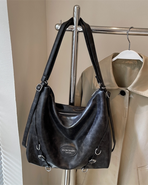 Black slouchy hobo shoulder bag in sumptuous distressed leather with silver hardware and adjustable crossbody straps