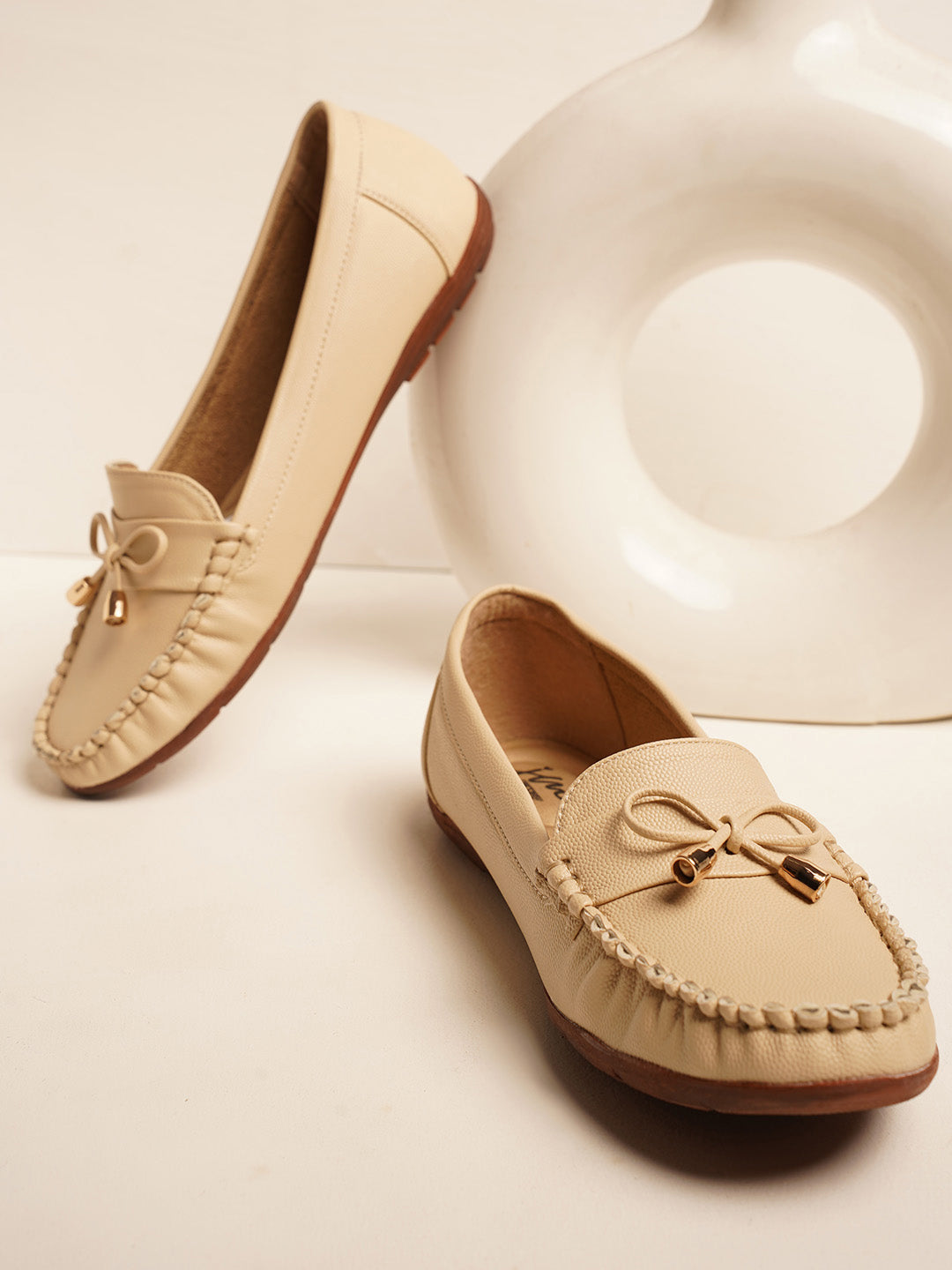 JM Looks women's driving loafers with a bow detail and stitched moc toe
 Cream