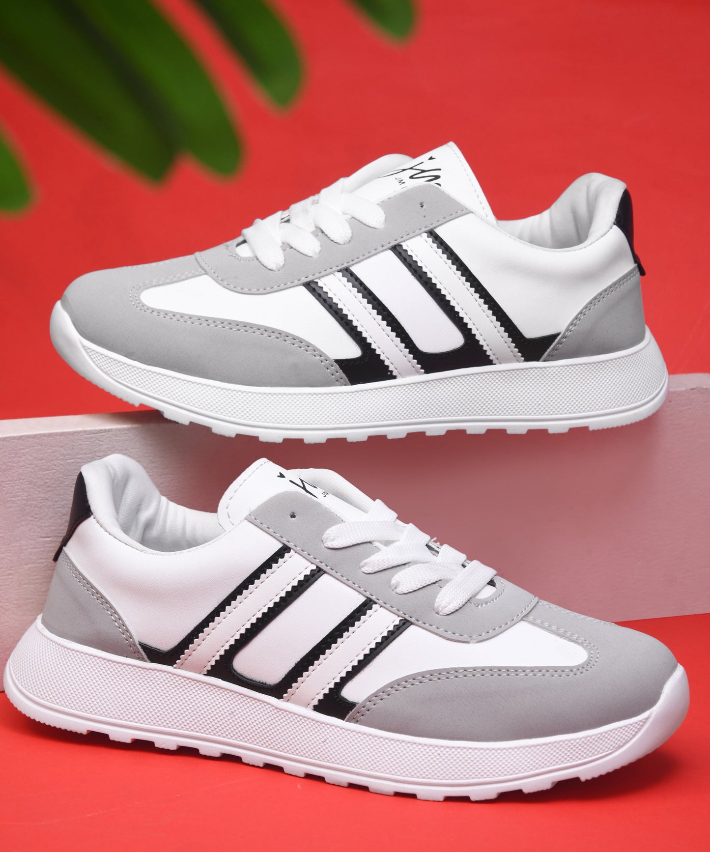 Women's lace-up casual sneakers in grey white with black stripe detailing on cushioned white platform sole
