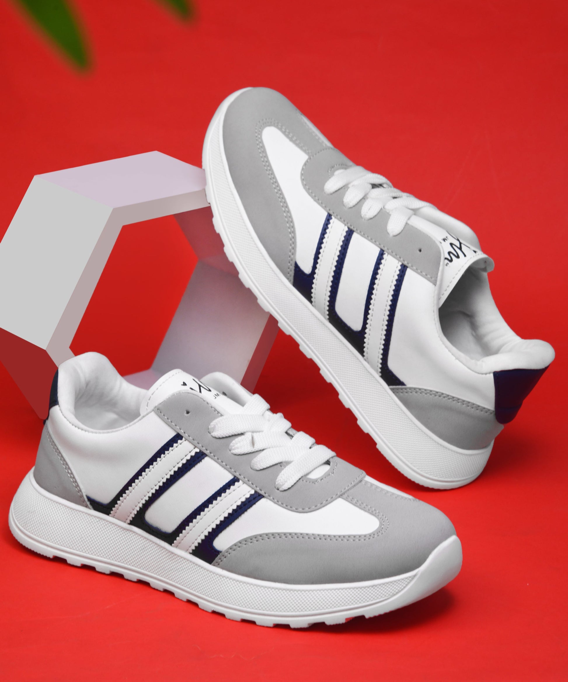 Women's lace-up casual sneakers in grey white with blue stripe detailing on cushioned white platform sole