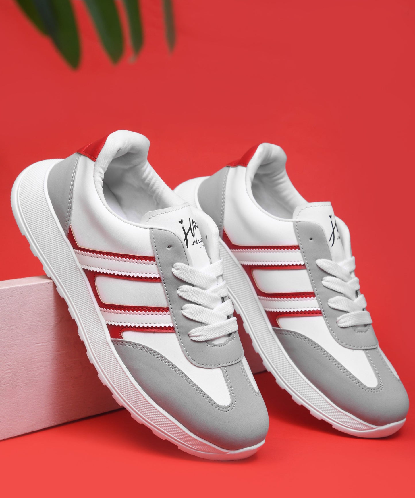 Women's lace-up casual sneakers in grey white with red stripe detailing on cushioned white platform sole