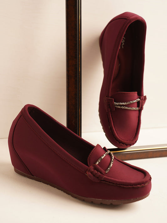 loafers with a subtle wedge heel and an embellished buckle detail on the vamp
 Cherry