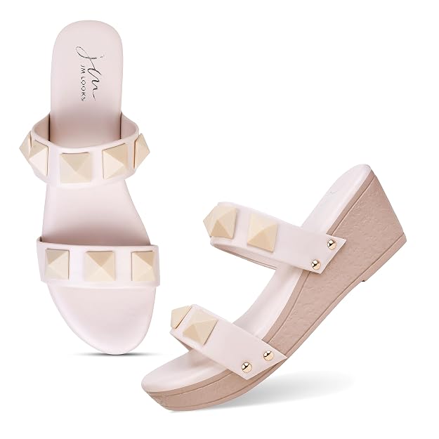 Wedge heels for women featuring cream pyramid studded dual straps and blush pink platform slip-on sole