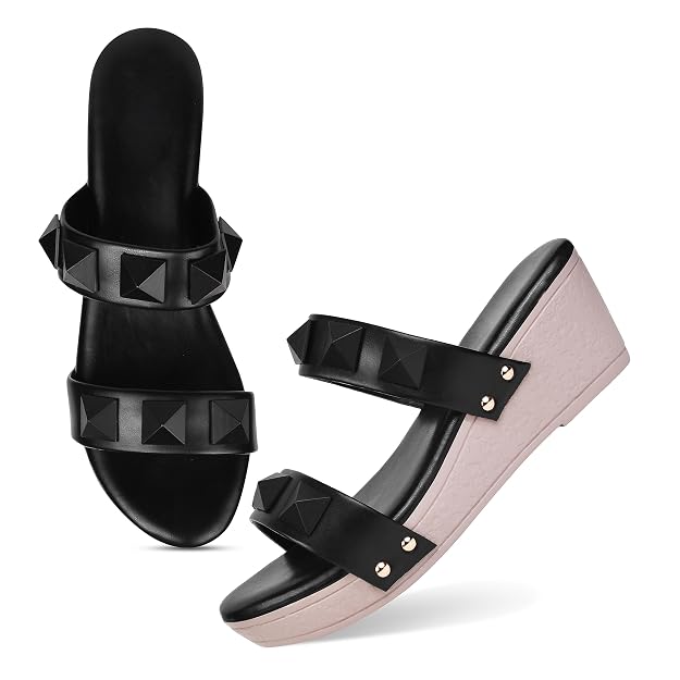 Wedge heels for women featuring black pyramid studded dual straps and blush pink platform slip-on sole